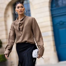 A person shown wearing clothing or an accessory.