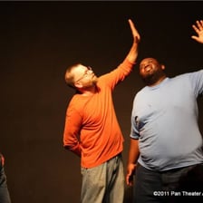 Improvisational theater performers responding to a scene suggestion
