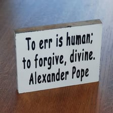 A literary quotation displayed in a classic book setting.