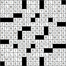 Person constructing a crossword puzzle on paper