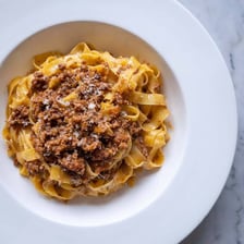 A bowl of thick Italian ragù meat sauce.