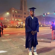 A college graduate wearing a cap and gown
