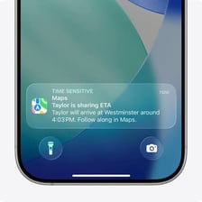 A phone displaying a text exchange about someone’s location and arrival time.