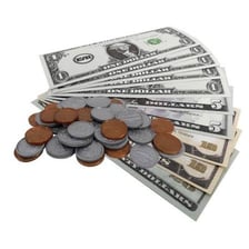 Banknotes and coins arranged together.