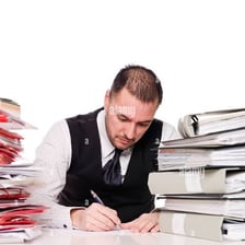 A person working strenuously at a demanding task