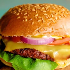 A plant-based burger served with dairy-free cheese