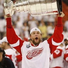 A hockey player with a full beard during the postseason