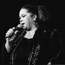 Etta James performing onstage as a blues singer.