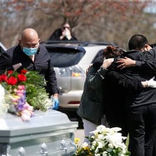 A person grieving at a funeral