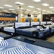 A Serta mattress displayed in a bedroom or mattress showroom.