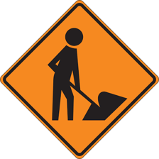 A roadside warning sign indicating construction ahead.