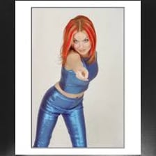 Geri Halliwell, known as Ginger Spice, posing for a portrait