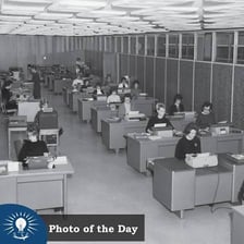Stenographers working together in a mid-century office typing pool.