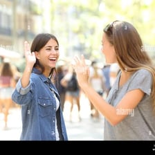 Two friends calling out to greet each other
