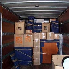 A moving van loaded with household boxes