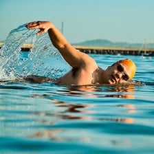 A person swimming through water.