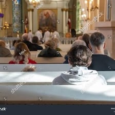 A congregation seated during a religious service.