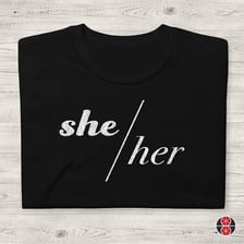 The pronoun pairing “he/she” displayed with a slash