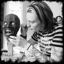 Practical makeup effects depicting graphic horror-film injuries.