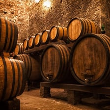 A wooden wine cask in a vineyard cellar.
