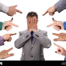 A person pointing toward someone else to assign blame.