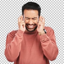 A person crossing their fingers with a hopeful, worried expression.