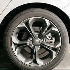 Close-up of a vehicle wheel fitted with a tire