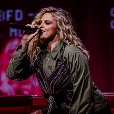 Renee Rapp performing as a singer on stage