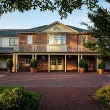 The exterior of a traditional inn used as lodging.