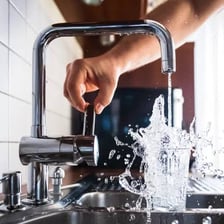 Water running from a faucet while it is not being used.