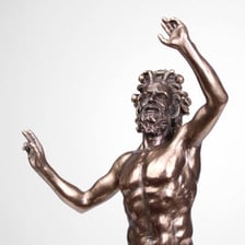 A classical statue depicting a faun