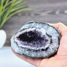 A geode opened to reveal sparkling crystals inside