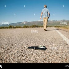 A person walking away from a location.