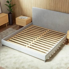 Wooden slats supporting a mattress in a bed frame