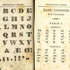 Children learning the alphabet from a primer