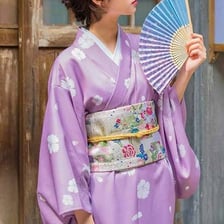 A colorful obi sash tied over a Japanese kimono