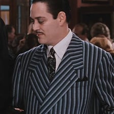 Raúl Juliá portraying Gomez Addams.