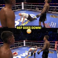 A boxing referee stopping a match after a technical knockout