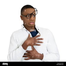 A studious young person with glasses and books