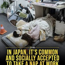 A person resting during a brief nap at a desk