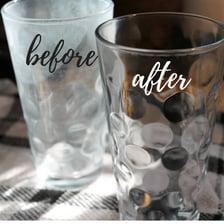 A visibly dirty drinking glass that needs to be washed