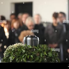A person mourning at a memorial.