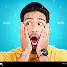 A person reacting with surprise to unexpected news.
