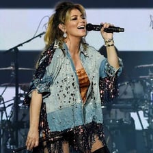 Shania Twain performing onstage.
