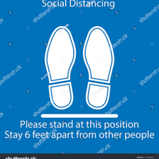 A person stands with their toes at a line marked on the floor.