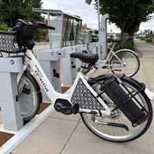 Several electric bicycles parked together.