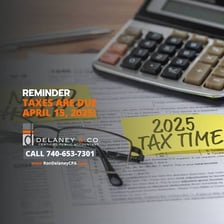 An accountant reviewing tax documents at a desk