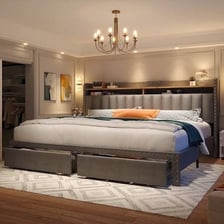 A king-size mattress on a bed in a bedroom.