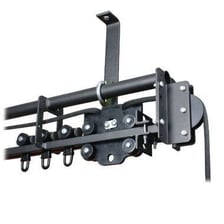 A curtain track mounted above a theater stage.