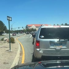 A car traveling within a marked roadway lane